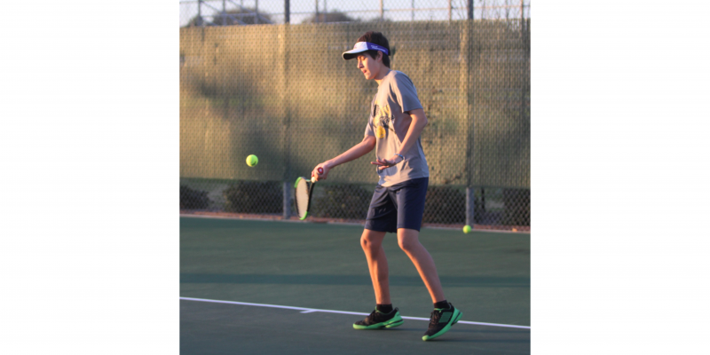 Sealy’s Eric Wilson returns a ball during a practice at the tennis courts on March 5, 2020. (Cole McNanna/Sealy News)