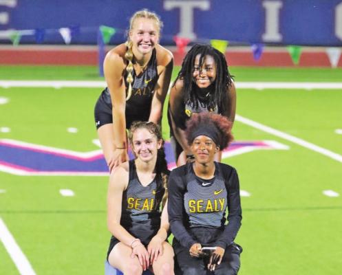 Sealy’s Breanna Brandes, Hollie Brown, Annabelle Williams and Taniah Coleman claimed the District 24-4A championship in the 4x400-meter relay Wednesday night, April 13, in Wharton. COURTESY PHOTO