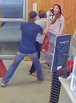 TOP: In video footage released by Austin County District Attorney Travis Koehn’s office shows Betty Smith lunging for the then-store manager after she took the $50 bill from Smith’s hands. ABOVE: Three employees restrain Smith after she lunged at the store manager. CONTRIBUTED PHOTOS