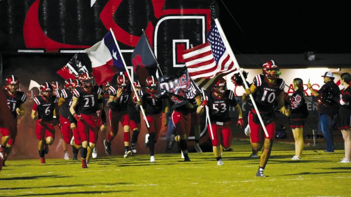 Led by senior Ja’Vien Dickerson and the American flag, Brazos charged onto the field last Friday for their final district contest against Boling. Brazos finished the year with a 6-4 overall record and just missed out on a playoff berth. COURTESY PHOTOS