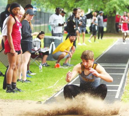 Sealy junior Connor Krenek lands in the sandpit after a jump attempt during the 2019 Area Championship hosted at T.J. Mills Stadium. FILE PHOTOS