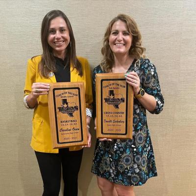 Sealy High School coaches Caroline Owen and Danielle Eschenburg received their plaques at the July 12 banquet in Arlington for being named the Texas Girls Coaches Association’s basketball middle school coach of the year and cross country sub-varsity coach of the year, respectively. CONTRIBUTED PHOTO