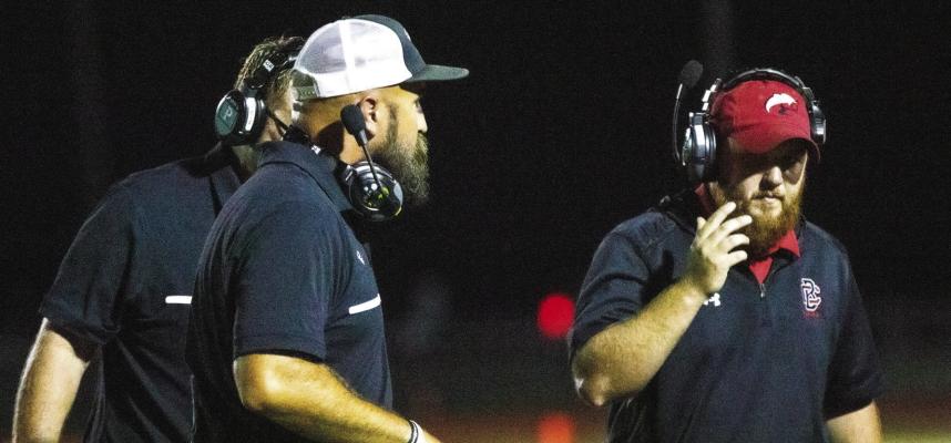 Brazos Head Football Coach Ryan Roecker, left, will take his Cougars into the bi-district round of the playoffs against an undefeated Lexington squad. PHOTO BY JIMMY GALVAN