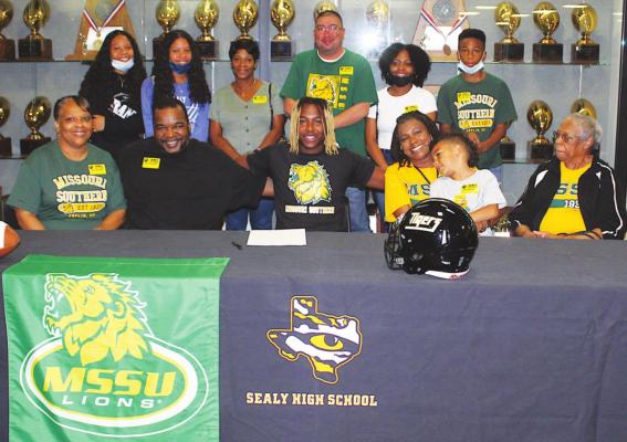 Draper Parker was joined by family at the ceremony where he signed his National Letter of Intent to play football for the Missouri Southern State Lions in the fall. COLE McNANNA