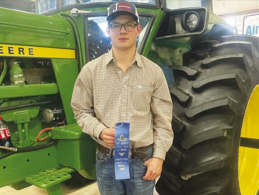 Brazos FFA officially ended San Antonio Expo last week with Luke Vykukal exhibiting his tractor restoration project and earning a blue ribbon, and the livestock team competing as well. Now the group is competing at Rodeo Houston. COURTESY PHOTO