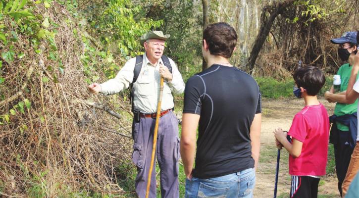 Volunteer Jack Philley shared facts about various plants along the trail during the First Day Hike last Saturday, Jan. 1. HANS LAMMEMAN