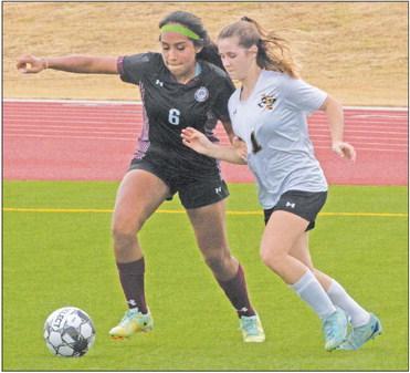Sealy sophomore Avery Schalla works the ball up the field during a recent contest.
