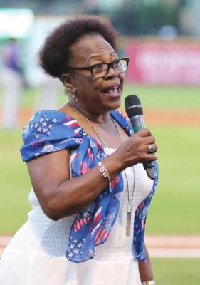 Former Sealy City Councilwoman Yvonne Johnson sings”God Bless America” during the seventh inning stretch of the Sealy Day at the Skeeters at Constellation Field in Sugar Land June 30, 2019. FILE PHOTO