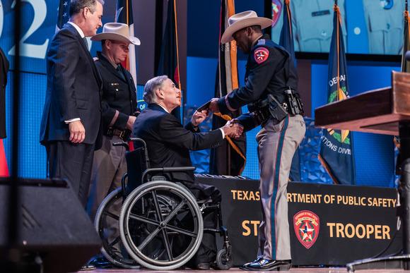 Texas Governor Greg Abbott congratulates one of the new Texas Department of Public Safety’s recruit class during a ceremony held in Austin last week. COURTESY PHOTO