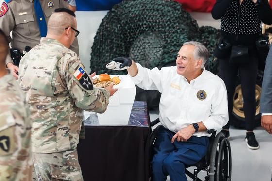 Abbott, Trump serve Thanksgiving meals to Operation Lone Star service members