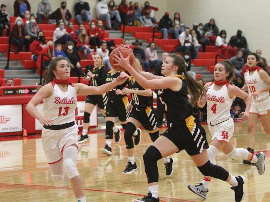 Sealy senior Brylie Bond reaches for a pass in the Lady Tigers’ first district game against the Brahmanettes on Jan. 8 at Bellville High School. In the teams’ second meeting, Bellville secured the season sweep last week at Sealy High School. (Cole McNanna/Sealy News)