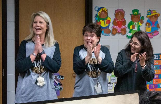 Marci Rabius, Melody Anderson and Jinna Bolivar share their excitement after they received a $4,000 grant for Pre-K learning centers at Maggie B. Selman Elementary School. COLE MCNANNA