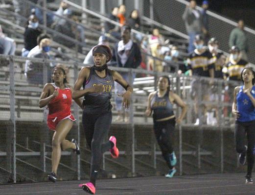 Sealy freshman Taniah Coleman sprints her way to first place in the 200-meter dash at the annual Sammy Dierschke Relays at T.J. Mills Stadium March 11. It was one of five first-place finishes for Coleman, which set a school record. COLE McNANNA