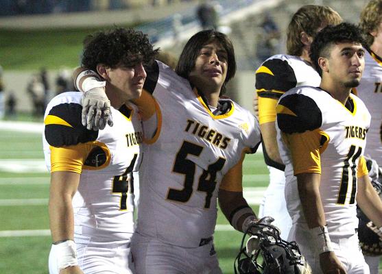 Sealy seniors Joel Chavez and Jonathan Monterroza embrace following the Tigers' defeat to China Spring in the Area Championship Friday night at Waco ISD Stadium. COLE McNANNA