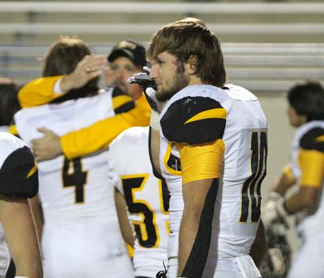 Tiger senior Thomas Clark surveys the postgame scene after Sealy's loss in the second round of the playoffs in Waco Friday night. COLE McNANNA