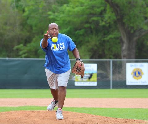 Bellville Police Department Lieutenant Kevin Bellville fires a pitch during the blue’s first-round game against Make Softball Great Again Saturday afternoon at the Bellville Little League fields. (Cole McNanna/Sealy News)