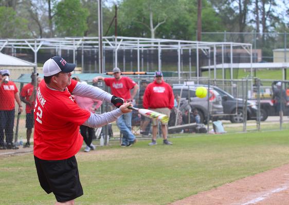 Austin County Fire/EMS’ Jason Greene connects with a pitch during the Guns N’ Hoses Softball Tournament at the Bellville Little League fields Saturday afternoon. (Cole McNanna/Sealy News)