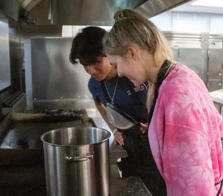 Daniel Medrano and Ashley Schoelman ensure water quality on the stove of the culinary kitchen on the second floor of Sealy High School. COLE McNANNA