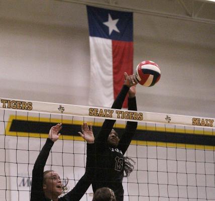 Sealy junior Jasmyne Joiner collects one of her two blocks in the Lady Tigers’ non-district match against Giddings last Tuesday at home. COLE MCNANNA