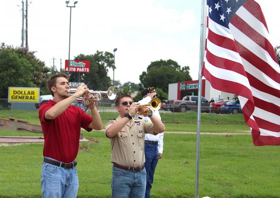 Sealy High School students Matthew Mlcak and Pete Ribardo perform taps as part of the Sealy American Legion’s Memorial Day Ceremony Monday morning, May 31. COLE McNANNA