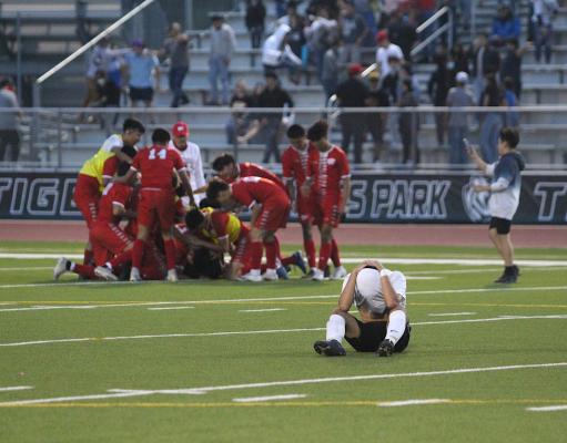 Sealy sophomore Angel Rodriguez buries his head while Splendora celebrates the regional semifinal victory they stole in the final minutes of regulation last Tuesday at Cy Park High School. (Cole McNanna/Sealy News)