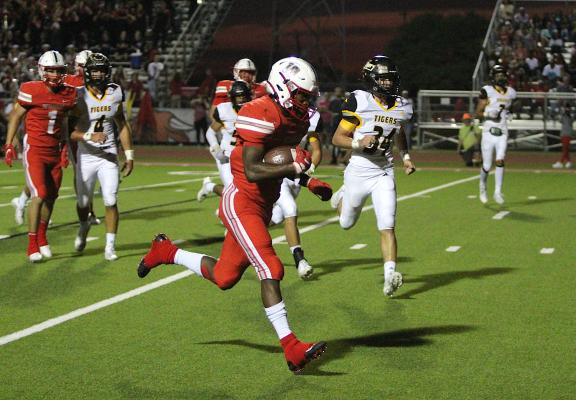 Bellville senior Richard Reese sprints to the corner of the end zone for one of his four touchdowns during the Brahmas’ rivalry district game against Sealy Oct. 15, 2021, at the Pasture of Pain. Reese was one of four Bellville representatives to crack a Padilla Poll All-State team. COLE McNANNA