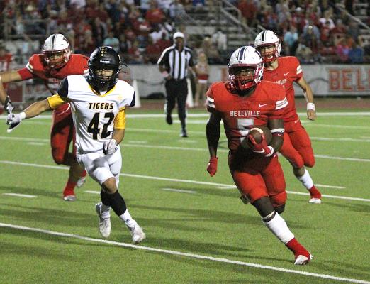 Bellville's Robert Briggs turns the corner on a first-half carry during the rivalry game against Sealy Oct. 15, 2021, at the Pasture of Pain. Briggs was named the first-team utility player and an honorable mention kick returner by the Texas Sports Writers Association. COLE McNANNA