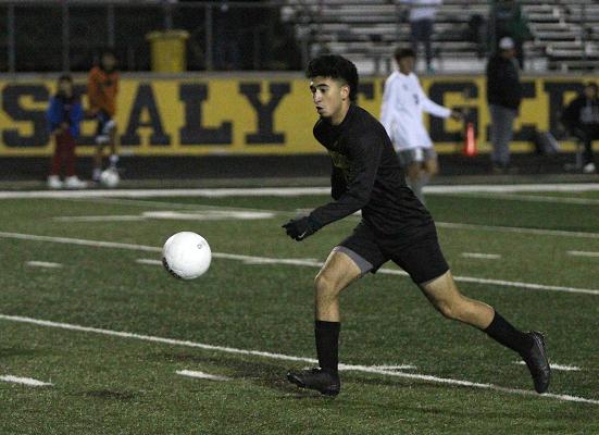 Sealy junior Amador Lopez chases down a loose ball in the offensive end of the Tigers’ first District 20-4A tilt against Hempstead last Friday at home. Lopez opened the game’s scoring to snap a five-game scoreless stretch. COLE McNANNA
