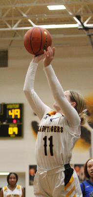 Sealy senior Evelyn Harrington rises for a shot in the final minute of the Lady Tigers’ district game Jan. 21 at home as part of a Friday night frenzy with four home games in the same night. COLE McNANNA
