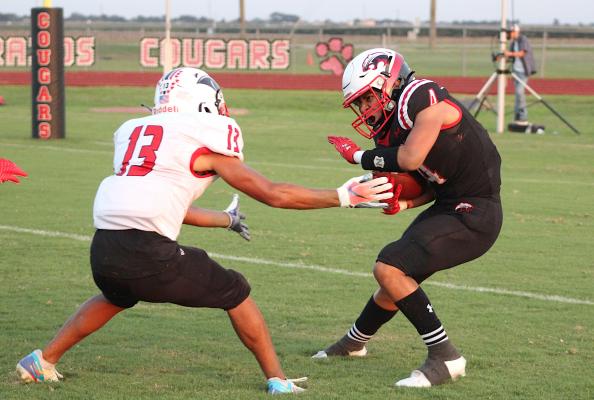 Brazos sophomore Jeffrey Martinez prepares to spin out of a tackle attempt from a Burton defender during the non-district game at home Sept. 10, 2021. The Cougars remained in the same district and region following UIL's biennial realignment Feb. 3. COLE McNANNA