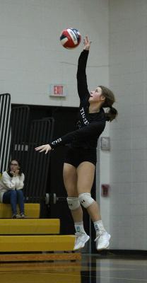 Sealy sophomore Blair Kram connects on a serve during the Lady Tigers’ non-district match against St. John XXIII at home Sept. 17. Kram was one of three to earn all-district second-team honors.