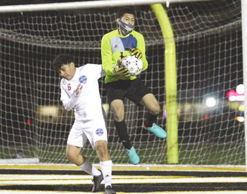 Sealy goalkeeper Brayan Aviles records a save during the Tigers’ District 20-4A contest against Houston Harmony School of Discovery last Friday on Mark A. Chapman Field at T.J. Mills Stadium in Sealy. The host Tigers won, 4-0. COLE McNANNA
