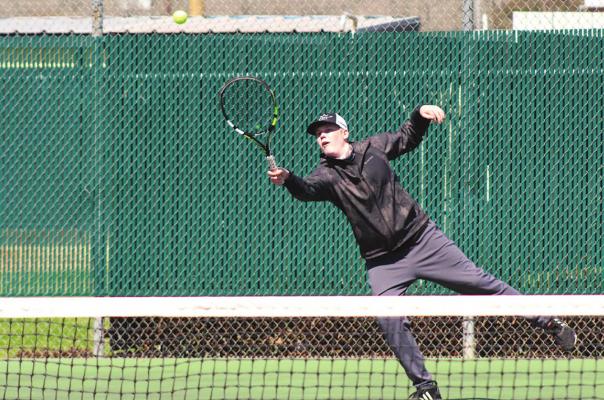Hayden Havel returns a shot during a doubles match at Sealy’s quad meet last week at home. COLE McNANNA