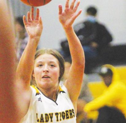 COLE McNANNA Sealy sophomore Blair Kram fires a three-point shot during the Lady Tigers’ season-opening game against Westside at home Nov. 9.