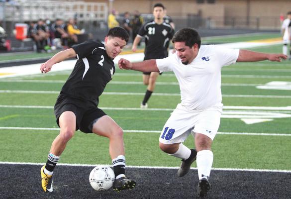 Sealy senior Ricky Avila puts on the breaks to create space between him and a Rice Consolidated defender during the district game at T.J. Mills Stadium Monday evening in Sealy. Avila finished with half of the Tigers’ goals in the 8-0 win. COLE McNANNA