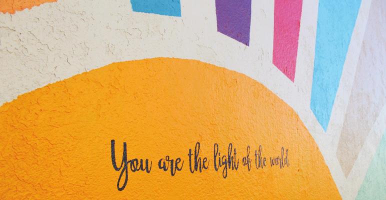 PHOTOS BY HANS LAMMEMAN Hillary-Kate Kotwal completed a mural on the northern wall of The R.O.M. Church in Sealy reading, “You are the light of the word,” last Saturday, Jan. 1.