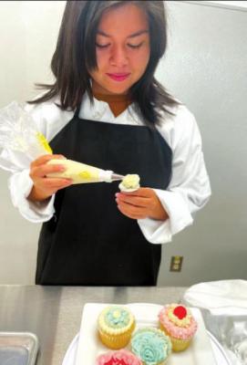 In November 2021, Ponce won the Culinary Arts Career Conference (CACC) Culinary Competition and was similarly awarded $3,500 in scholarship funds. She is pictured exhibiting the piping technique that helped her win the category. CONTRIBUTED PHOTO
