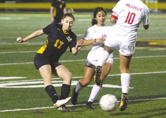 Lady Tiger senior Dania Picasso sends a ball into Bellville’s defensive end during the second half of district action at Sealy’s T.J. Mills Stadium Monday night. COLE McNANNA