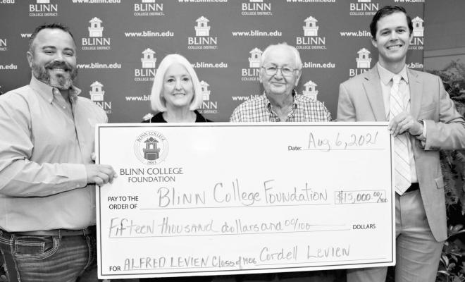 Alfred Levien, who attended Blinn College in 1906, is being honored with a new endowed scholarship given by his son, Cordell Levien. The scholarship will go to a student in Blinn’s Agricultural Sciences Program. Pictured from the left are Dr. Bryn Behnke, Assistant Dean for Agriculture and Natural Sciences; Dr. Mary Hensley, Blinn Chancellor; Cordell Levien; and Sam Sommer, Chair of the Blinn College Foundation. CONTRIBUTED PHOTO