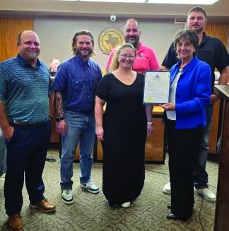 The city of Sealy honored its Public Works team during last week’s council meeting. Back row, from left, is Patrick Parsons, public works director, Nick Hagen, water superintendent, Travis Cockran, wastewater treatment superintendent, Hunter Kmiec, gas superintendent. Front row, Brooke Kaiser, public works administrator and Sealy Mayor Carolyn Bilski. Not pictured is Stephen Bozich, parks, recreation, streats, drainage and buildings superintendent. Courtesy photo