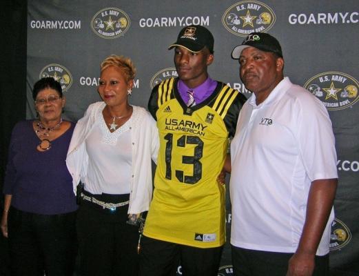 Sealy’s Ricky Seals-Jones (13) was a five-star recruit after his career as a Tiger, which earned him a spot in the U.S. Army All-American game as a senior. Pictured is Seals-Jones with (from left) his grandmother Bobbie Seals, mother Buffy and father Chester during a ceremony on Monday, Nov. 19, 2012, at Sealy High School. (File photo)