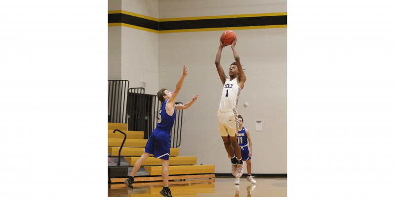 Tiger senior Donte Beasley rises up to intercept a pass during a non-district game against Brazosport Christian Jan. 9. Beasley took advantage of his 6’ 6” frame to lead the team in blocks and deflections and was near the team lead in steals and was ultimately named the district’s defensive MVP. (Cole McNanna/Sealy News)