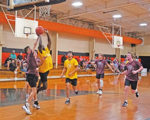 Guard Avonte Nunn attacks the basket for a score in the Sealy Tigers 48 to 30 win over the Fayetteville Lions on Monday June 20. Left to right: Avonte Nunn and Mason Klotz. JASON MANAGO-GRAVES