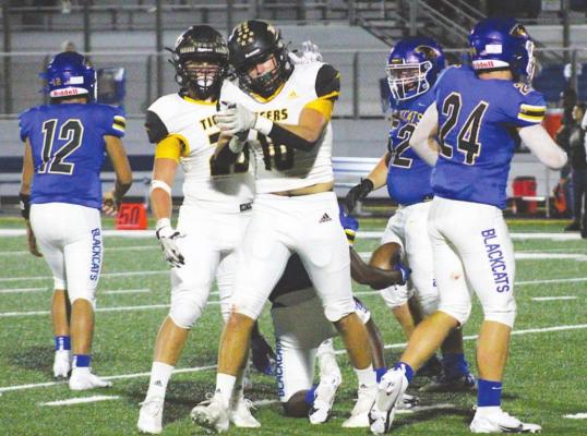 Sealy senior Thomas Clark celebrates a tackle during the Tigers’ non-district finale in Bay City Sept. 24. The experienced leader will be one of those to help guide the team through its district slate that starts Friday. COLE McNANNA