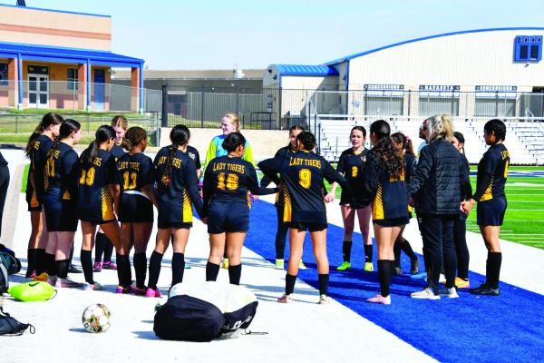 The Sealy Lady Tigers gather before a recent contest before heading out to the field. Sealy is sporting a 7-3 record through 10 games this season.