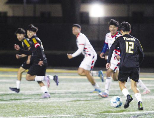 The action was fast and furious in front of the goal for the Sealy Tigers contest. Sealy will return to action Jan. 22 against Harmony School of Discovery. PHOTOS BY ABENEZER YONAS