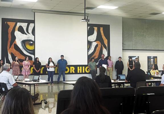 Sealy High School Director of Bands George Theodoroulis hands out awards to his band students for their accomplishments during the 2024-2025 school year. ABENEZER YONAS | SEALY NEWS