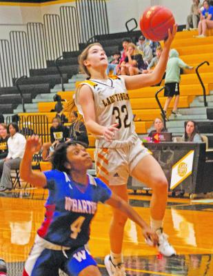 Sealy freshman Kara Kram goes up for a layup during the Lady Tigers’ victory over Wharton. PHOTO BY JIMMY GALVAN