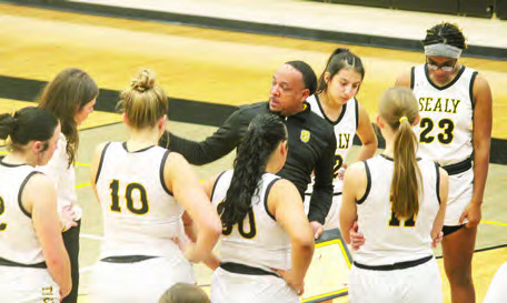 Lady Tigers head Coach Ray Dabney draws up a play during a timeout. SEALY NEWS | EVAN HALE
