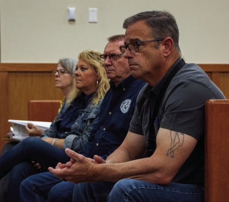 Donald Darracq, Bryan Haevishchan, Kim Spacek and Liz Cubz watch public comments about data centers during Austin County Commissioners Court, Monday, June 8, in Bellville. PHOTO BY THE SEALY NEWS | ALLISON DRINNON